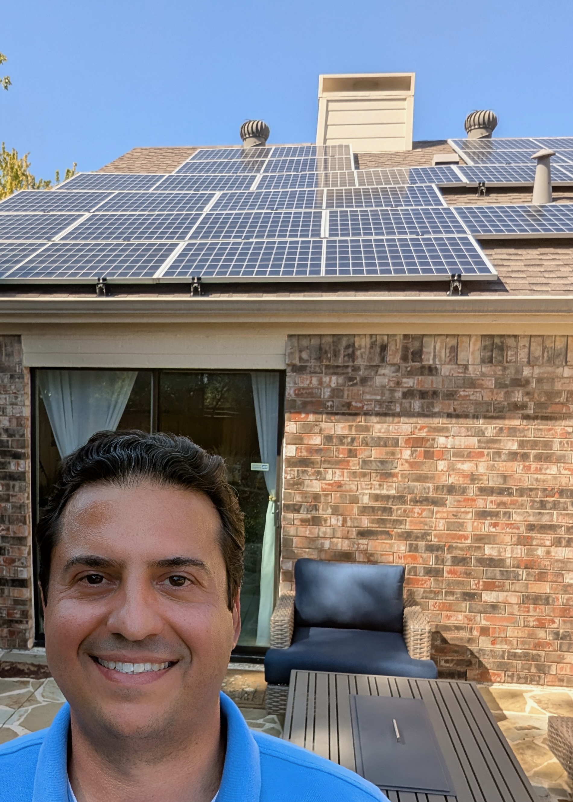 Mike Cogliandro at his home in North Texas, beneath his own rooftop solar array